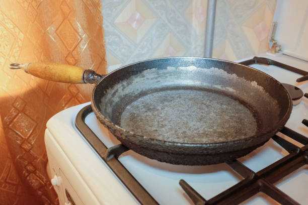 Step-by-step image of cleaning burnt residue from a cooking pan easily
